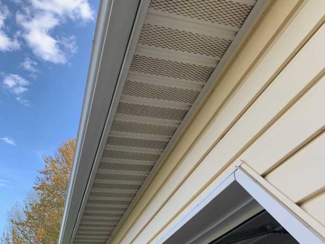 After_soffit over garage soft wash cleaning